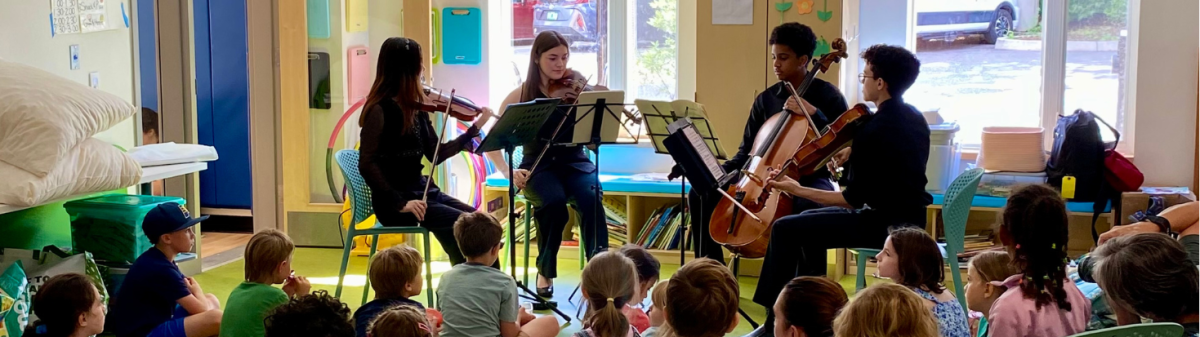 students performing for a group of kids