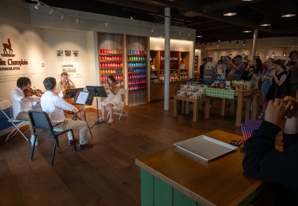 students performing in a chocolate shop