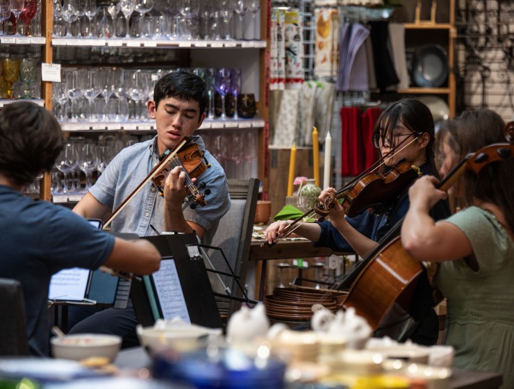 a string quartet playing in a home goods store