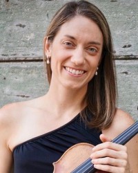 A woman with a one-shoulder black dress holding a violin