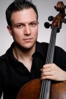 Alex Croxton holding a cello